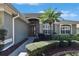 Inviting home entrance with a decorative door and well-manicured landscaping at 3110 Bent Creek Dr, Valrico, FL 33596