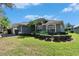 Well-maintained home with manicured landscaping and lush green lawn at 3110 Bent Creek Dr, Valrico, FL 33596