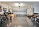 Spacious garage with ample storage space and a shiny gray epoxy floor, ready for vehicles or hobbies at 3110 Bent Creek Dr, Valrico, FL 33596