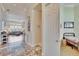 Hallway with tile flooring leading to living area and bedrooms at 3110 Bent Creek Dr, Valrico, FL 33596