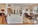 Open kitchen and dining area with granite countertops, stainless steel appliances, and stylish light fixture at 3110 Bent Creek Dr, Valrico, FL 33596