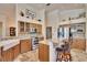 Bright kitchen featuring granite countertops, stainless steel appliances, and a cozy breakfast bar at 3110 Bent Creek Dr, Valrico, FL 33596