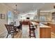 Open kitchen and living space featuring granite countertops, stainless steel appliances, and large dining table at 3110 Bent Creek Dr, Valrico, FL 33596