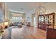 Spacious living room with hardwood floors, plantation shutters, and natural light at 3110 Bent Creek Dr, Valrico, FL 33596