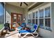 Relaxing outdoor living area with lounge chairs, grill, and shaded patio at 3110 Bent Creek Dr, Valrico, FL 33596