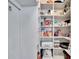 Walk-in pantry with ample shelving offering abundant storage for all your kitchen essentials and groceries at 3110 Bent Creek Dr, Valrico, FL 33596