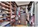 Spacious walk-in closet with custom shelving and ample storage at 3110 Bent Creek Dr, Valrico, FL 33596