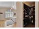 View of main bedroom leading to walk-in closet with custom shelving and organization system at 3110 Bent Creek Dr, Valrico, FL 33596