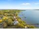 Breathtaking aerial view of waterfront homes with private docks along the riverfront under a sunny sky at 316 Shore E Dr, Oldsmar, FL 34677
