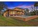 Lovely home featuring a pool with a stone waterfall and a partially covered patio space for outdoor living at 316 Shore E Dr, Oldsmar, FL 34677