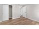 Neutral bedroom featuring wood floors and a closet for storage at 316 Shore E Dr, Oldsmar, FL 34677