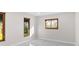 Cozy room with white walls, marble tile flooring, and natural light from wooden windows at 316 Shore E Dr, Oldsmar, FL 34677