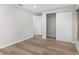 Neutral bedroom with closet, light walls, and wood-look flooring at 316 Shore E Dr, Oldsmar, FL 34677
