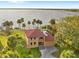 Coastal home boasts waterfront access, lush landscaping, and a spacious layout perfect for relaxation at 316 Shore E Dr, Oldsmar, FL 34677