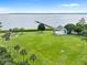 Park featuring large green space, a covered stage, a pier, and views of the bay at 316 Shore E Dr, Oldsmar, FL 34677