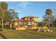 Beautiful view of the home's outdoor patio, tile roof, and backyard at 316 Shore E Dr, Oldsmar, FL 34677