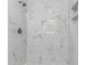 Walk in shower with marble tiling, a shower niche, and sleek shower head at 316 Shore E Dr, Oldsmar, FL 34677