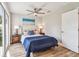 Bedroom includes a closet, ceiling fan, and French door to exterior at 6142 4Th S Ave, St Petersburg, FL 33707