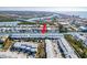 Aerial view of waterfront condos with boat docks, conveniently located near the bridge and waterfront amenities at 657 Garland Cir, Indian Rocks Beach, FL 33785