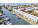Waterfront community featuring private boat slips, community pools, and manicured landscaping at 657 Garland Cir, Indian Rocks Beach, FL 33785