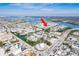 Beautiful aerial view showcases a waterfront condo community with boat access and nearby roadways on a clear day at 657 Garland Cir, Indian Rocks Beach, FL 33785