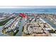 Lovely aerial view of a waterfront condo community with boat docks, close to local amenities and roads at 657 Garland Cir, Indian Rocks Beach, FL 33785