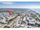 Aerial view of waterfront condos with boat docks, conveniently located near the bridge and waterfront amenities at 657 Garland Cir, Indian Rocks Beach, FL 33785
