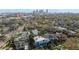 Aerial view of a residential neighborhood showcasing a modern two-story home with mature trees at 720 16Th Ne Ave, St Petersburg, FL 33704