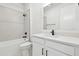 Modern bathroom with white vanity, subway tile shower, and sleek fixtures at 11341 Hardwood Hammock Ln, Riverview, FL 33569
