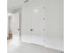 Neutral bedroom with white door and neutral carpeting at 11341 Hardwood Hammock Ln, Riverview, FL 33569