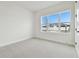 Sunlit bedroom features a large window and plush carpeting at 11341 Hardwood Hammock Ln, Riverview, FL 33569