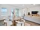 Dining area with modern table, chairs, and sliding doors offers picturesque views at 11341 Hardwood Hammock Ln, Riverview, FL 33569