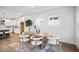 Dining area adjacent to the kitchen features stylish furnishings and ample light at 11341 Hardwood Hammock Ln, Riverview, FL 33569