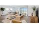 Bright living room features stylish furniture, large windows, and serene lake views at 11341 Hardwood Hammock Ln, Riverview, FL 33569
