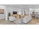 Open living space connects kitchen, dining, and living areas with stylish design at 11341 Hardwood Hammock Ln, Riverview, FL 33569
