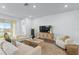 Cozy living room with comfortable seating, modern decor, and sliding glass doors at 11341 Hardwood Hammock Ln, Riverview, FL 33569