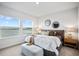 Bedroom features lake views, ample natural light, and tasteful decor at 11341 Hardwood Hammock Ln, Riverview, FL 33569