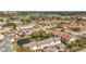 Aerial view of a neighborhood with a pond and golf course nearby at 13600 Egret Blvd # 204K, Clearwater, FL 33762