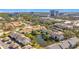 Aerial view of buildings with pond, trees and cityscape in the background at 13600 Egret Blvd # 204K, Clearwater, FL 33762