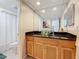 A clean bathroom featuring a granite vanity and a glass vessel sink at 13600 Egret Blvd # 204K, Clearwater, FL 33762