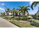 Beautiful home featuring tropical landscaping, a brick driveway and an attached garage at 17014 Clear Cork Dr, Wimauma, FL 33598