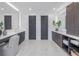 Bathroom featuring double vanities, storage, and private water closets for added privacy at 2081 Michigan Ne Ave, St Petersburg, FL 33703