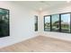 Bright bedroom boasts hard wood floors, modern windows overlooking tranquil views at 2081 Michigan Ne Ave, St Petersburg, FL 33703