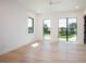 Bright bedroom boasts hard wood floors, modern windows overlooking tranquil views at 2081 Michigan Ne Ave, St Petersburg, FL 33703