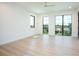 Bright bedroom boasts hard wood floors, modern windows overlooking tranquil views at 2081 Michigan Ne Ave, St Petersburg, FL 33703