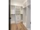 Spacious closet with custom shelving and drawers, maximizing storage and organization at 2081 Michigan Ne Ave, St Petersburg, FL 33703