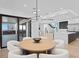 Bright dining room with modern lighting, light wood table, and stainless steel appliances visible at 2081 Michigan Ne Ave, St Petersburg, FL 33703