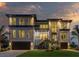 Beautiful modern home featuring clean lines, large windows, and manicured lawn at 2081 Michigan Ne Ave, St Petersburg, FL 33703