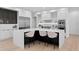 Elegant kitchen featuring a center island with seating, white cabinets, and high-end appliances at 2081 Michigan Ne Ave, St Petersburg, FL 33703