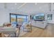 Spacious living room with modern furniture, tray ceiling, and view of the water at 2081 Michigan Ne Ave, St Petersburg, FL 33703